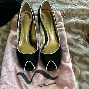 Black with white trim. Size 9 peek a boo heel